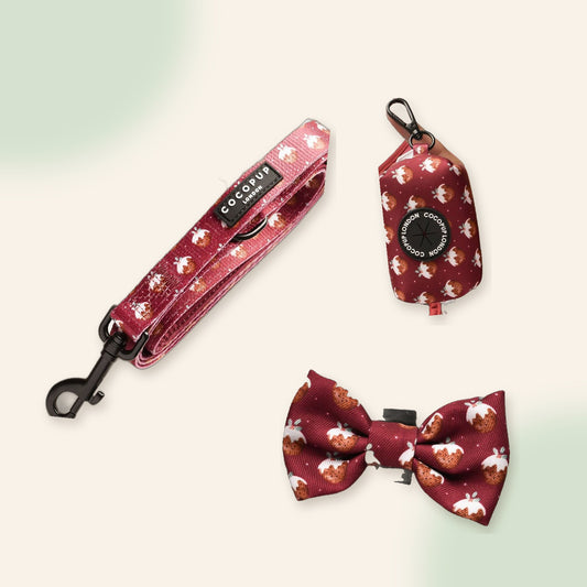 Christmas Walk Set flat lay: Woofmas Pudding lead, poop bag holder and bow tie