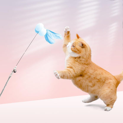 A cat leaping at a feather wand
