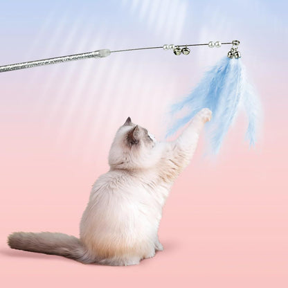 A cat batting a feather wand